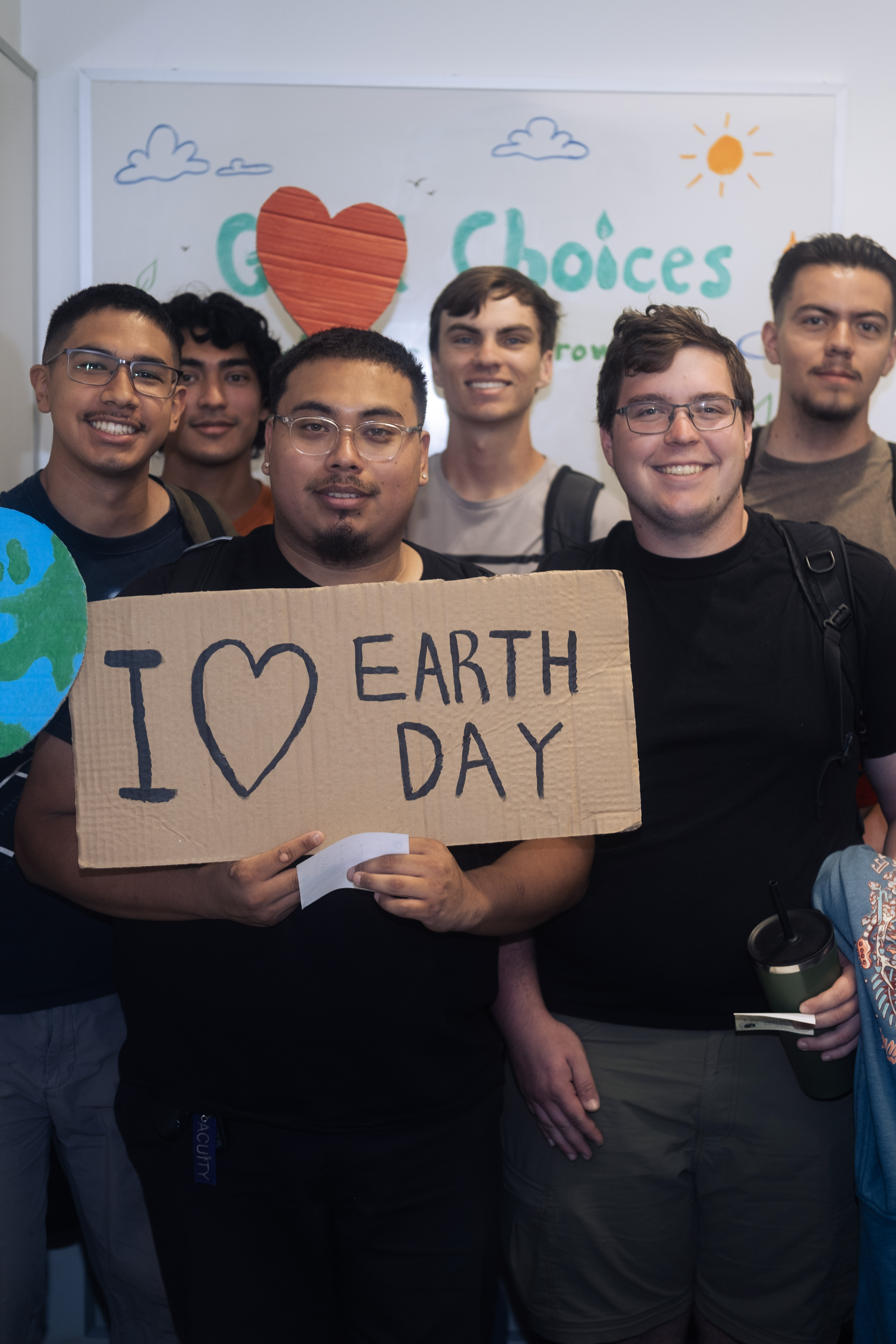 Group photo with earth day props